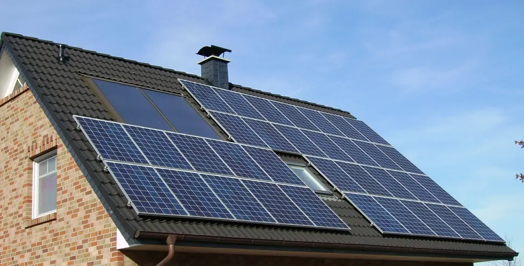 Solar panels on the roof of a brick house